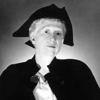 Moore in her tricorn hat and cape