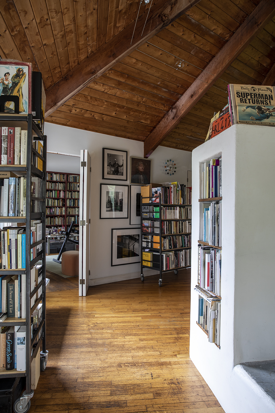 interior of Conover's home, with built-in book shelves and framed art.