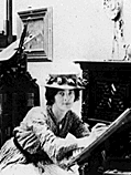 Loy at a drawing table in her studio.