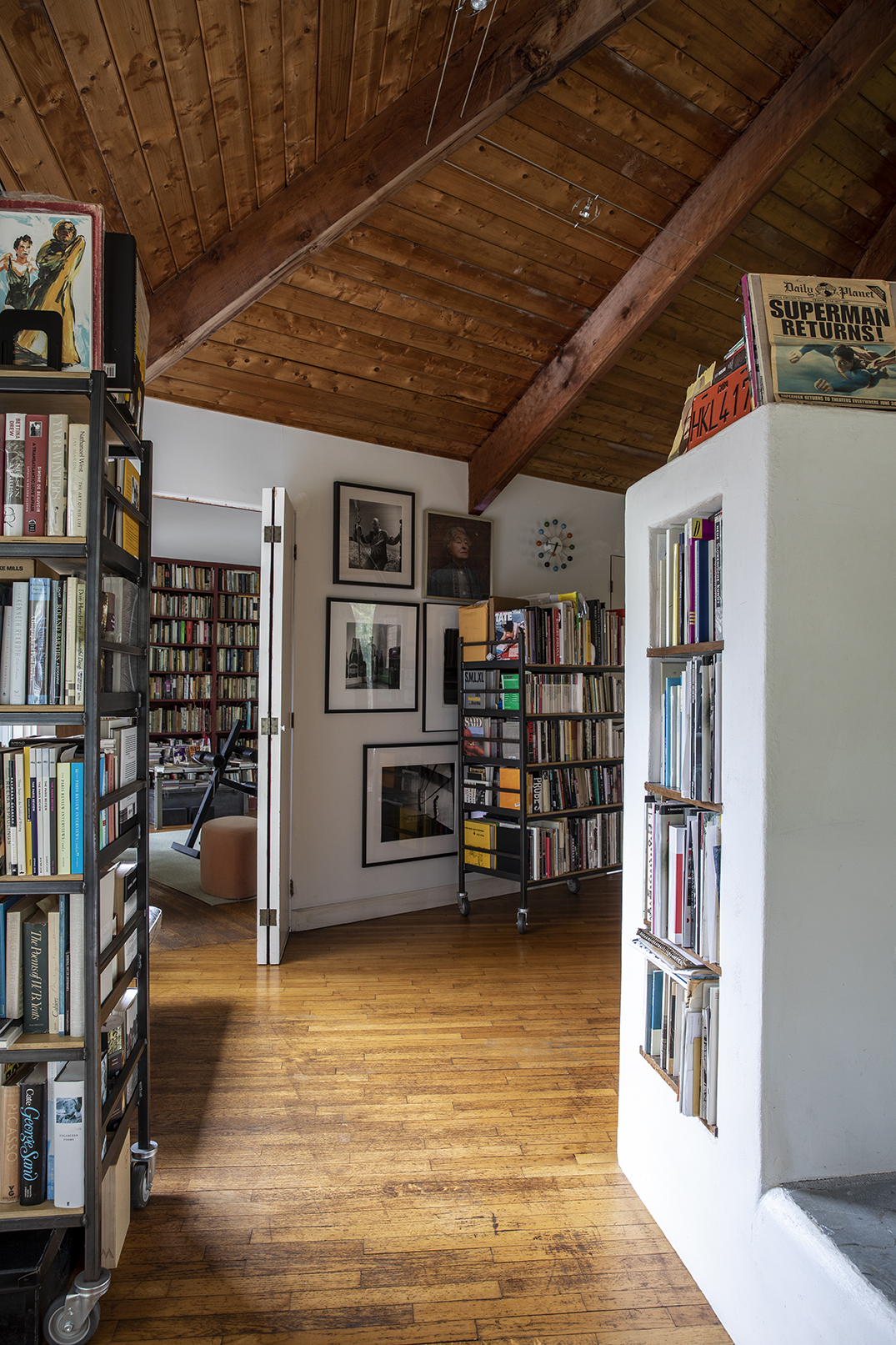 interior of Conover's home, with built-in book shelves and framed art.